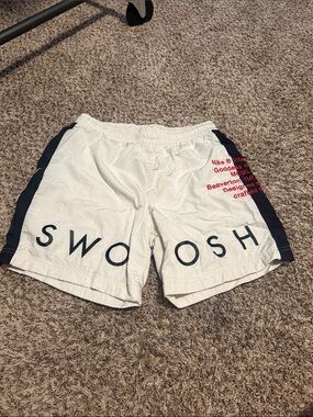 Nike White Athletic Shorts with black Side Panels and Red Logo